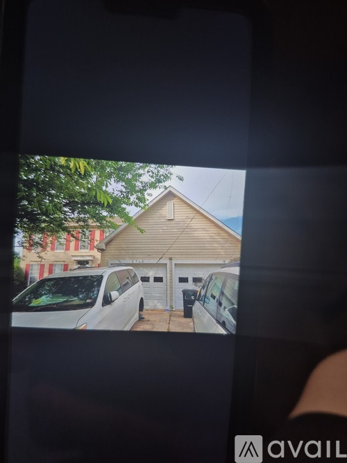 A house with a white van parked in front of it.
