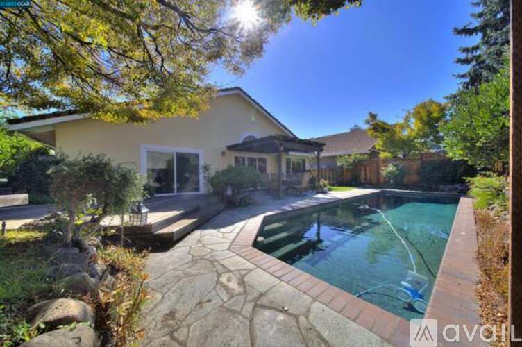 A house with a pool in the backyard.