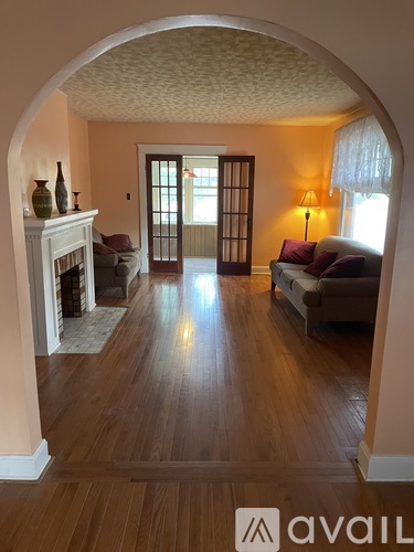 A living room with a fireplace and a couch.