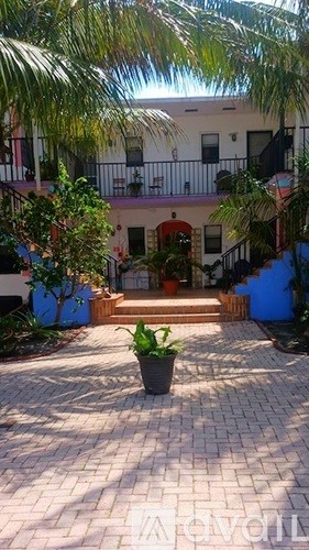 A courtyard with a potted plant in the center.