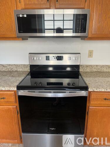 A stainless steel oven with the control panel showing 3 out of 5 knobs.