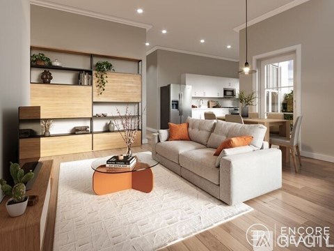 A modern living room with a white sofa, a coffee table, and a wooden cabinet with plants on top.