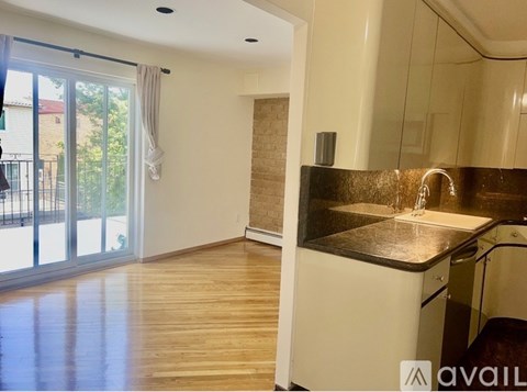 A kitchen with a sink and a countertop is visible.
