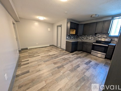 A kitchen with a stove top oven and a microwave.