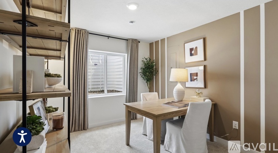 A well-lit dining area with a table set for four.