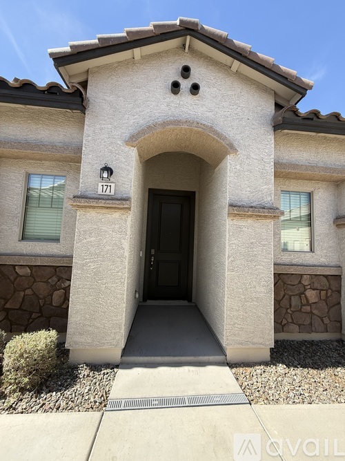 A house with the number 171 on the front door.