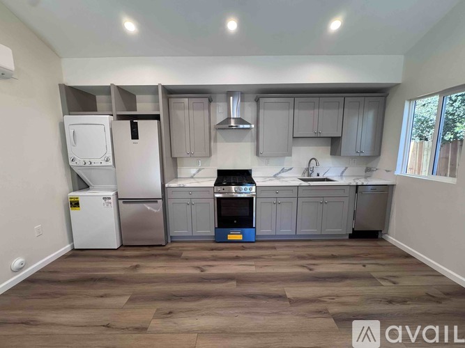 A kitchen with a white refrigerator, a white oven, and a white microwave.