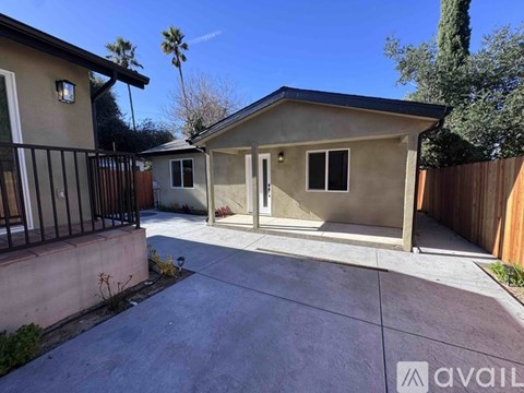 A house with a driveway and a fence.