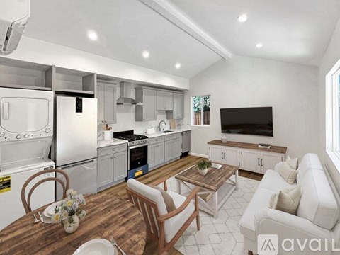 A modern kitchen with a dining table set for two.