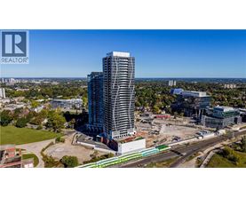 A tall building under construction with a clear blue sky in the background.