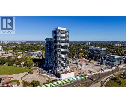 A tall building under construction with a clear blue sky in the background.