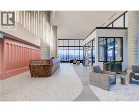 A modern interior space with a curved seating area and a reception desk.