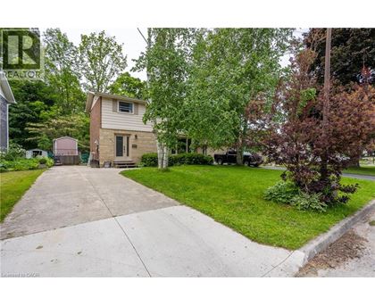 A house with a driveway in front of it.