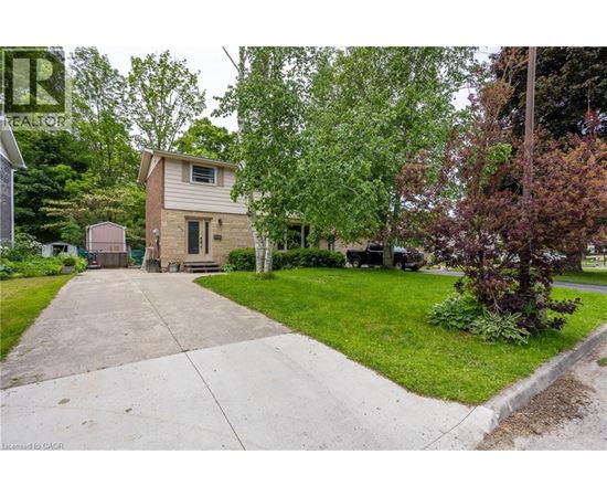 A house with a driveway in front of it.