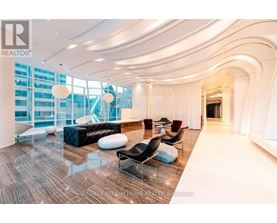 A spacious living room with a curved ceiling and modern furniture.