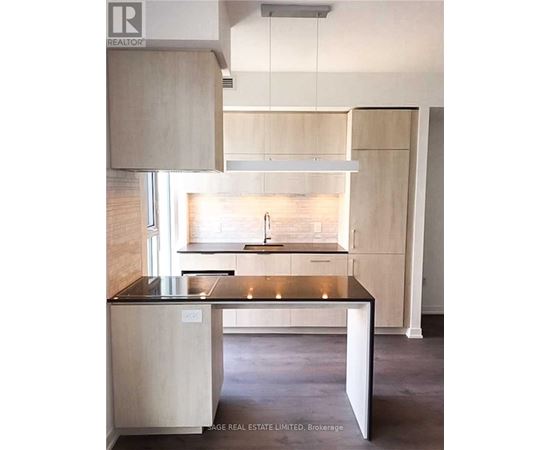 A kitchen with a sink and a window.