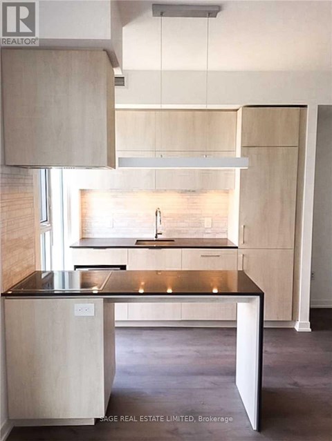 A kitchen with a sink and a window.