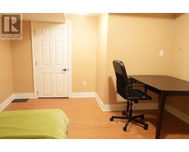 A room with a desk and a chair.