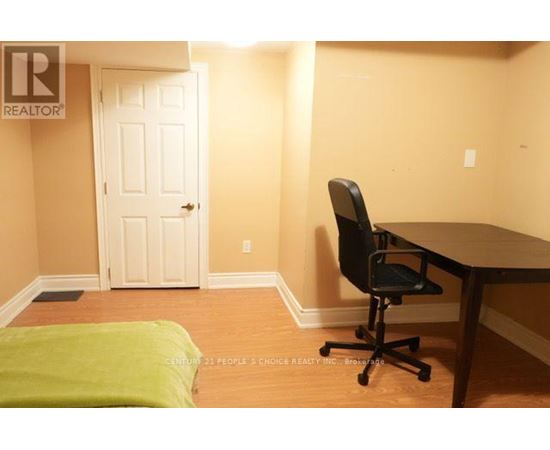 A room with a desk and a chair.