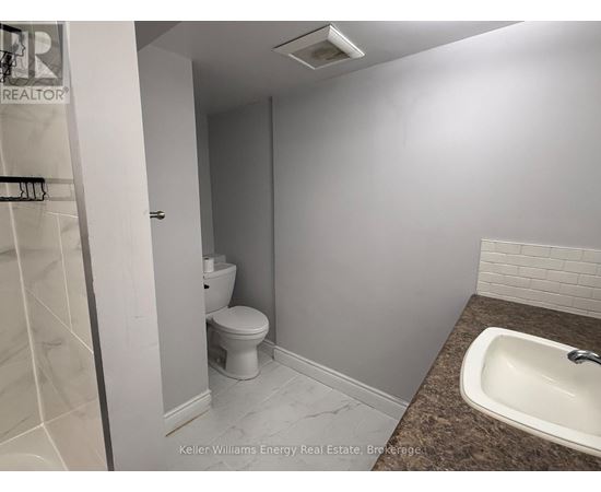 A small bathroom with a toilet and sink.