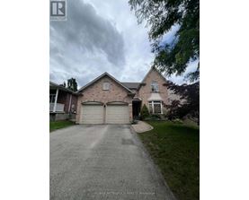A house with a driveway in front of it.