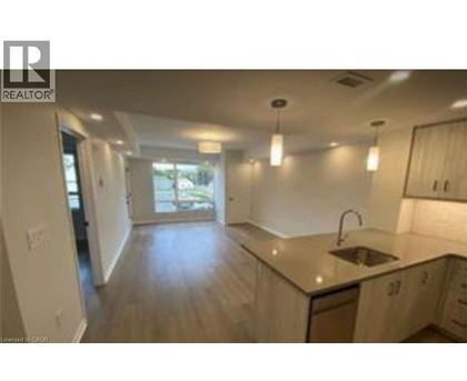 A kitchen with a sink and cabinets.