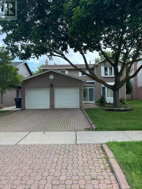 A house with a garage and a driveway.