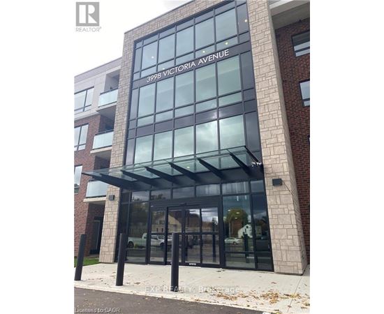 The entrance to a building with glass doors and windows.