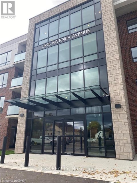 The entrance to a building with glass doors and windows.