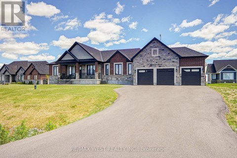 A real estate company is advertising a property with a large driveway and multiple garages.