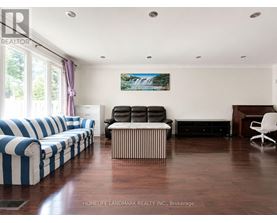 A living room with a blue and white striped couch.