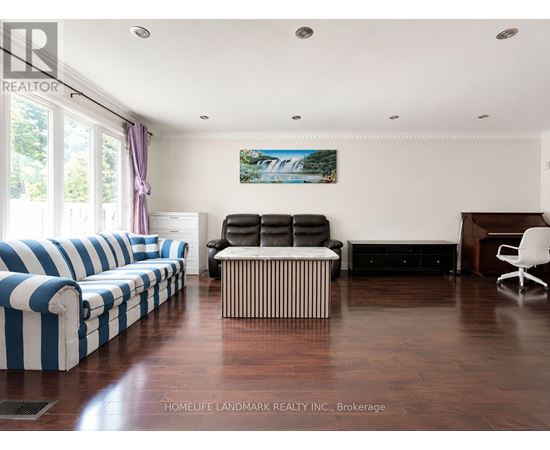 A living room with a blue and white striped couch.