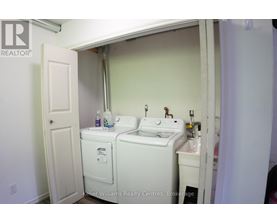 A small bathroom with a toilet and sink.