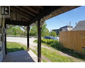 A porch with a sign that says REALTOR.