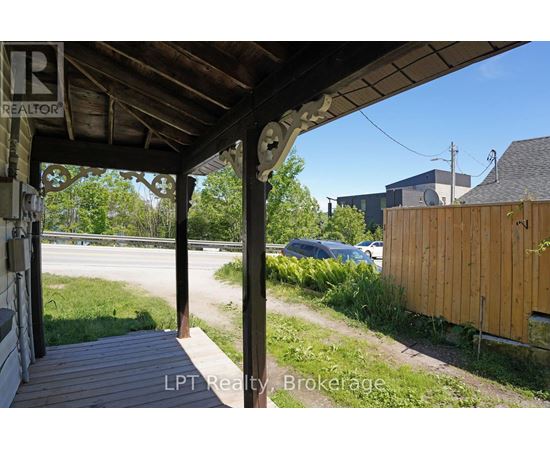 A porch with a sign that says REALTOR.