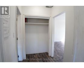 A white door with a sign that says REALTOR.