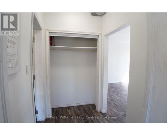 A white door with a sign that says REALTOR.