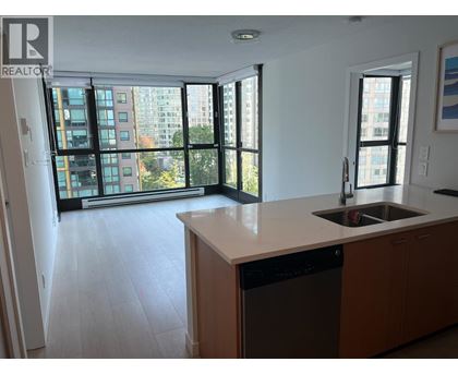 A kitchen with a dishwasher and a sink.