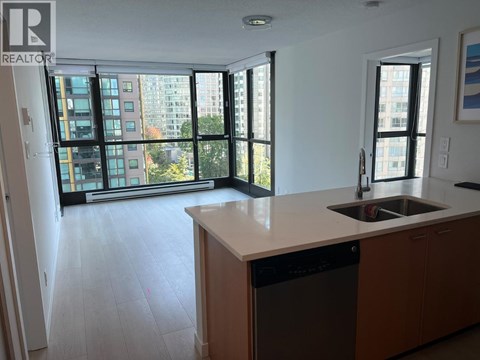 A kitchen with a dishwasher and a sink.
