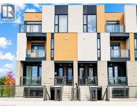 A modern building with a balcony and a glass door.