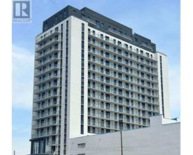 A tall building with many windows and balconies, with the words "KINGSWAY REAL ESTATE, Brokerage" on the side.