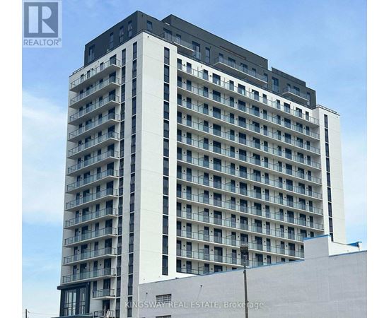 A tall building with many windows and balconies, with the words "KINGSWAY REAL ESTATE, Brokerage" on the side.