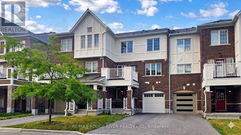 A row of townhouses with a clear blue sky above them.