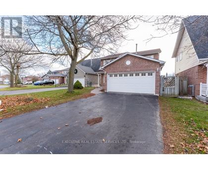 A house with a driveway in front of it.