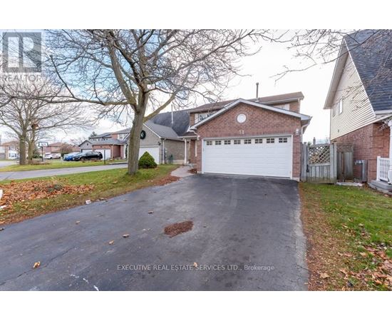 A house with a driveway in front of it.
