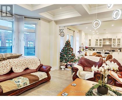 A living room with a Christmas tree and a couch.