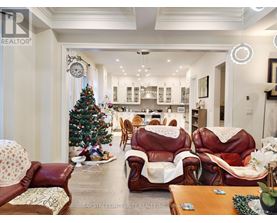 A living room with a Christmas tree and leather chairs.