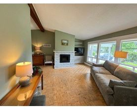 A living room with a fireplace and a couch.