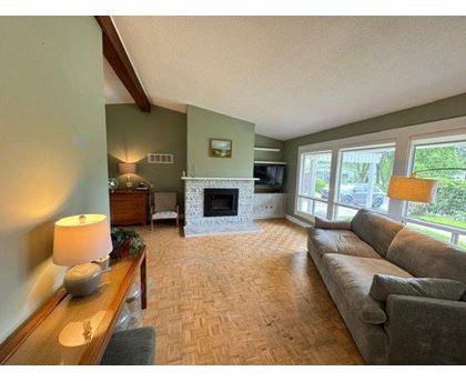 A living room with a fireplace and a couch.