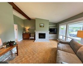 A living room with a fireplace and a couch.